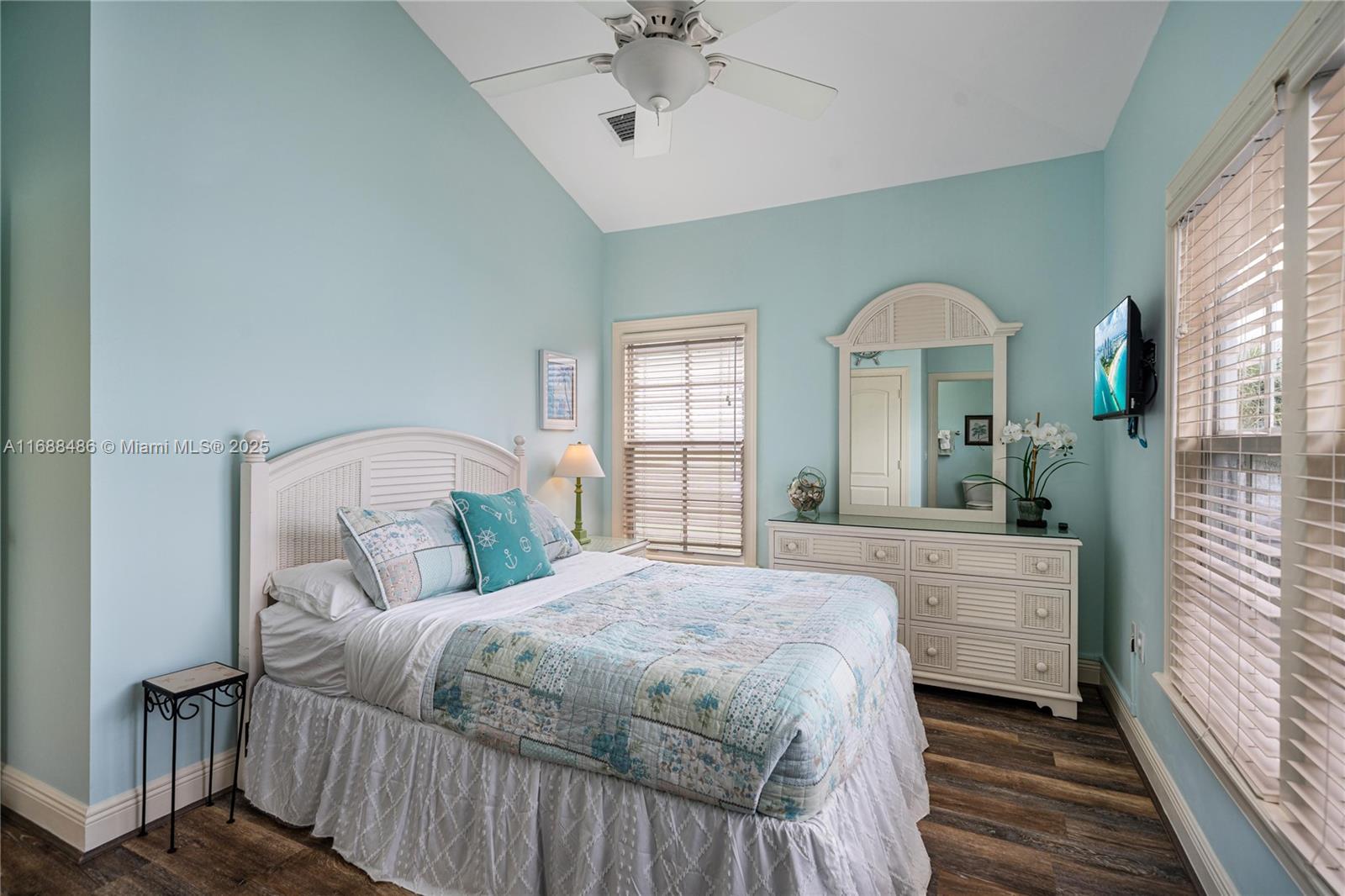 120 Anglers Way Islamorada, FL 33036 - Photo 17 of 36 a spacious bedroom with a large bed and a chandelier