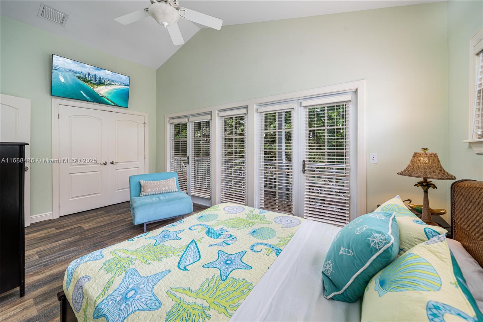 120 Anglers Way Islamorada, FL 33036 - Photo 20 of 36 a bedroom with a bed and wooden floor