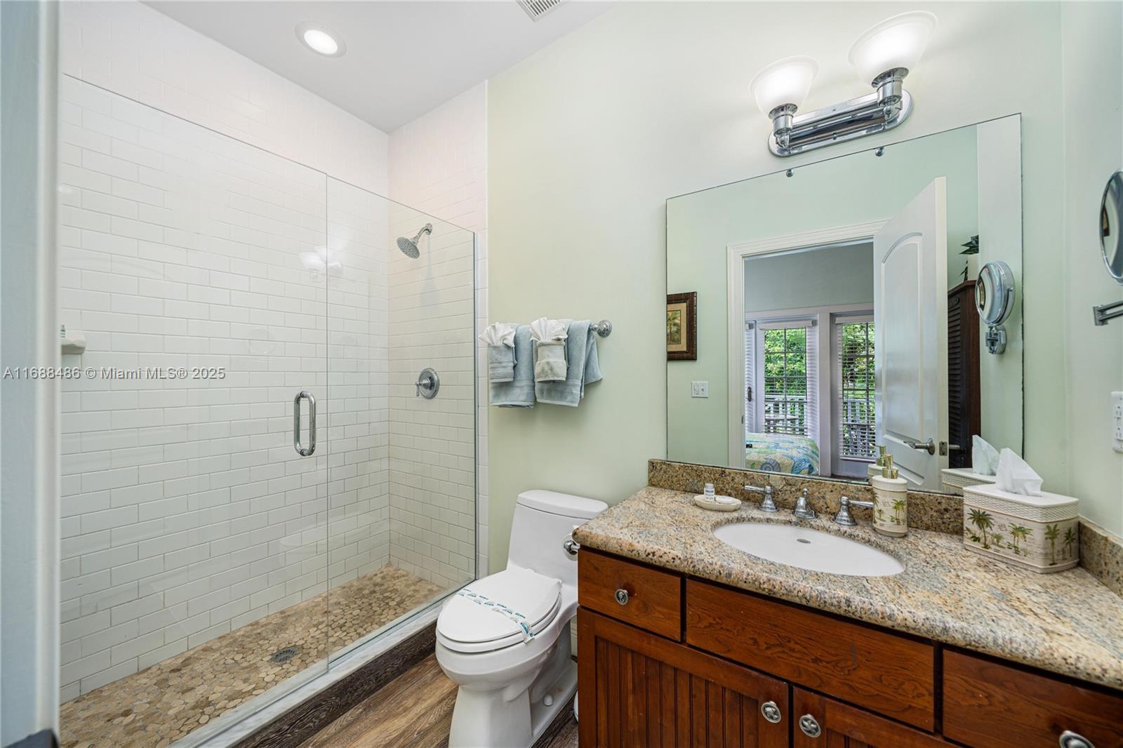 120 Anglers Way Islamorada, FL 33036 - Photo 21 of 36 a bathroom with a granite countertop sink toilet and shower