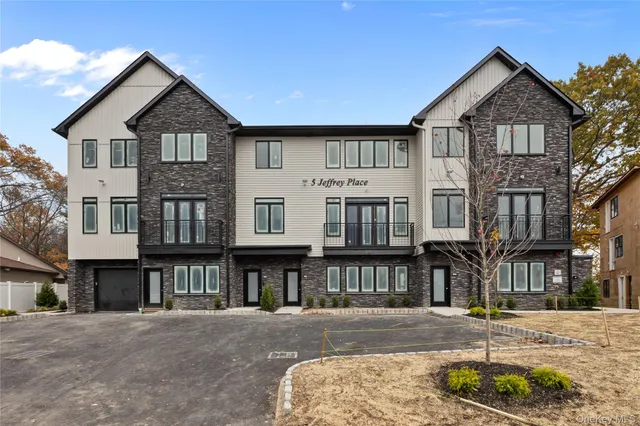a view of multiple houses with a yard