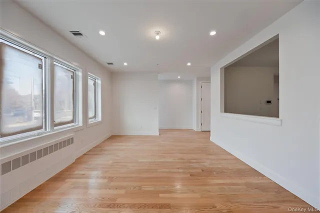 a kitchen with white cabinets white stainless steel appliances and sink