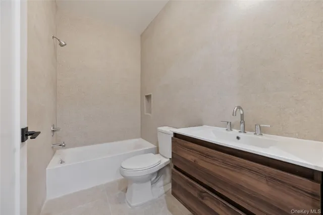 a bathroom with a sink a toilet and a bathtub