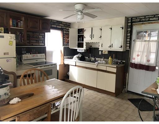 40 Middlefield Road Chester, MA 01011 - Photo 2 of 10 a kitchen with a sink stove and cabinets