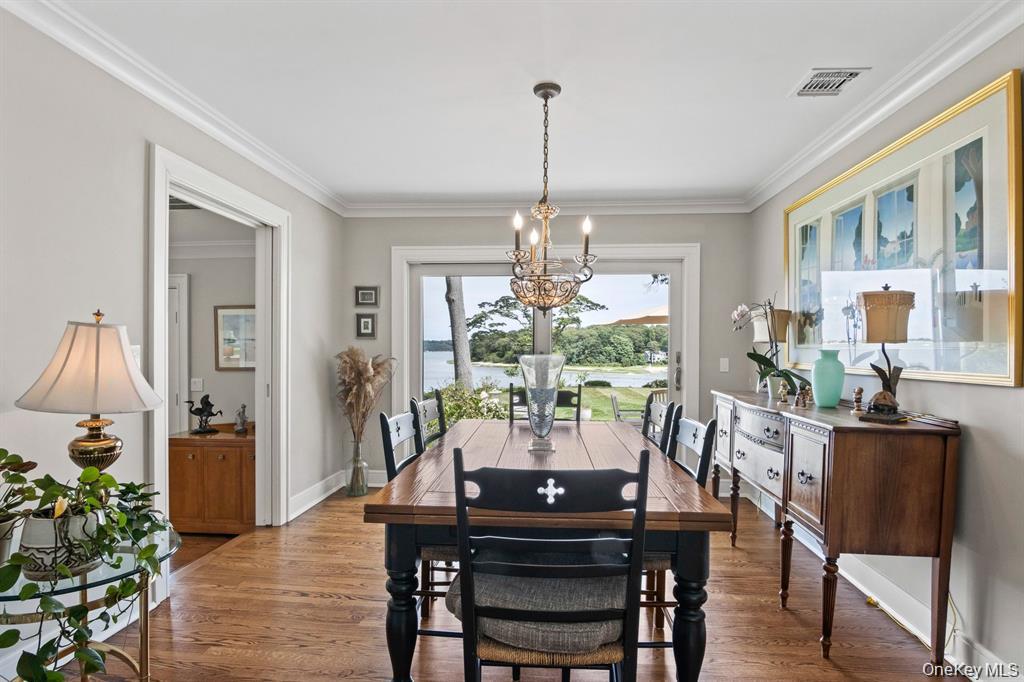 88 Dyke Road Setauket, NY 11733 - Photo 19 of 49 a view of a dining room with furniture window and wooden floor