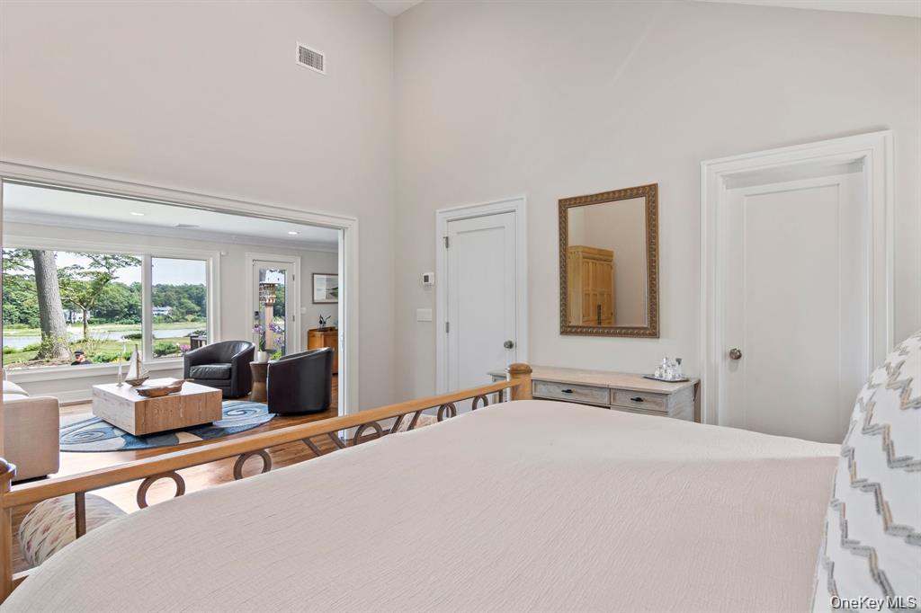 88 Dyke Road Setauket, NY 11733 - Photo 32 of 49 a bedroom with a bed and a large window
