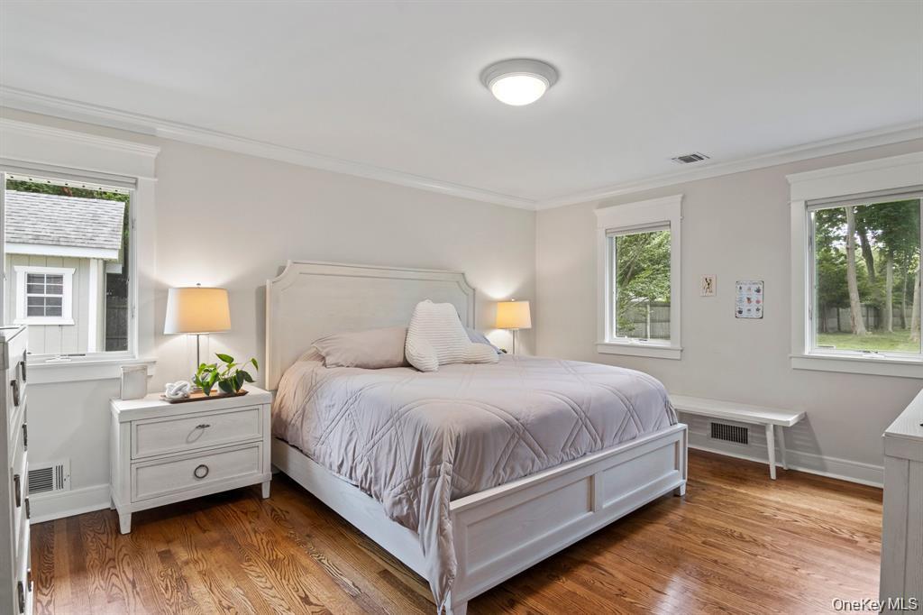 88 Dyke Road Setauket, NY 11733 - Photo 35 of 49 a bedroom with a bed and a large window