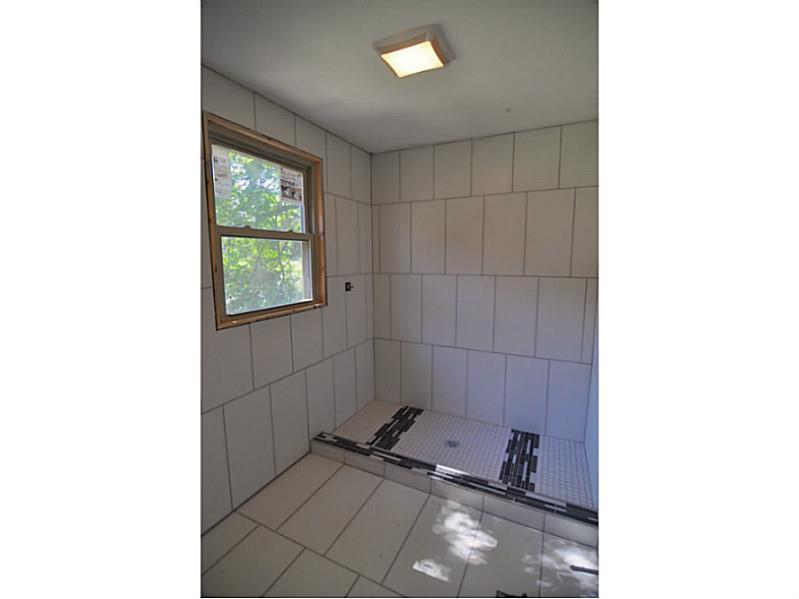 217 Tech Road Thornburg, PA 15205 - Photo 13 of 16 Master Bath/Spa. Glass splash panel being installed to close off this rain head master shower, buyer able to choose vanity or vanity top