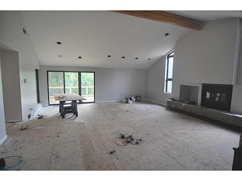 217 Tech Road Thornburg, PA 15205 - Photo 7 of 16 Great Room. Wood burning fireplace- ledge under fireplace to be refaced with tile.