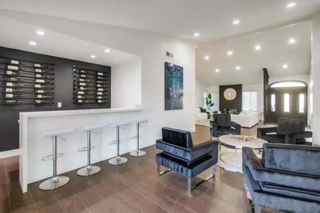 a kitchen with stainless steel appliances granite countertop a sink and stove