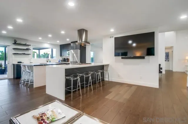 a spacious bedroom with a bed and a view of room