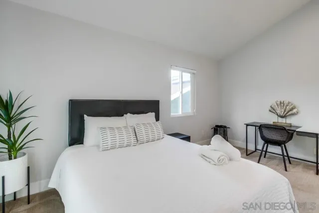 a view of a patio with table and chairs