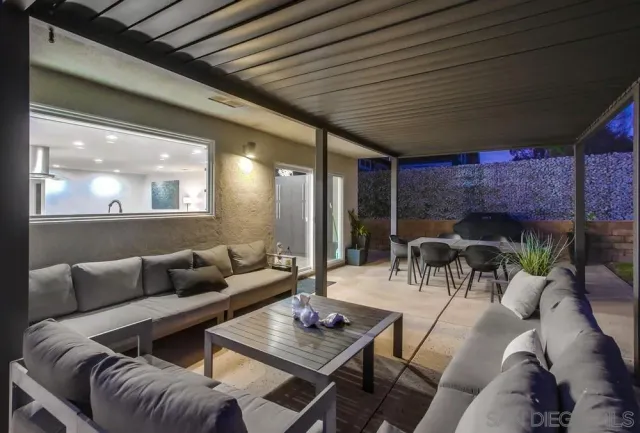 an aerial view of residential houses with outdoor space and street view