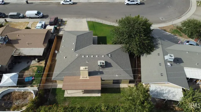an aerial view of multiple houses with outdoor space