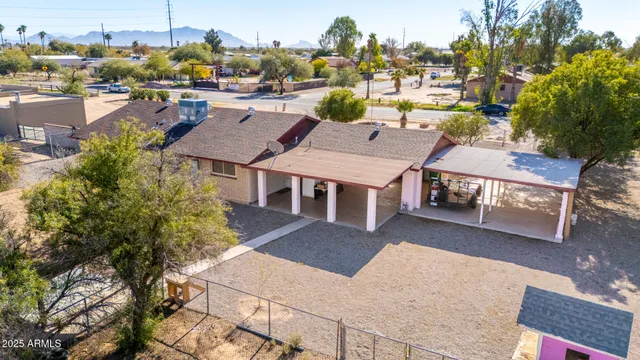 a view of a house with a yard and lake view