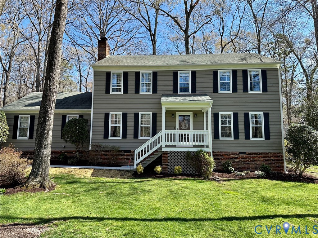 1013 Castle Hollow Road Midlothian, VA 23114 - Photo 1 of 1 Colonial house featuring a front lawn, a chimney,