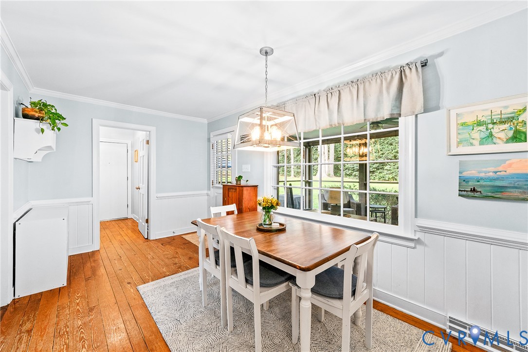 1013 Castle Hollow Road Midlothian, VA 23114 - Photo 12 of 45 a view of a dining room with furniture window and wooden floor