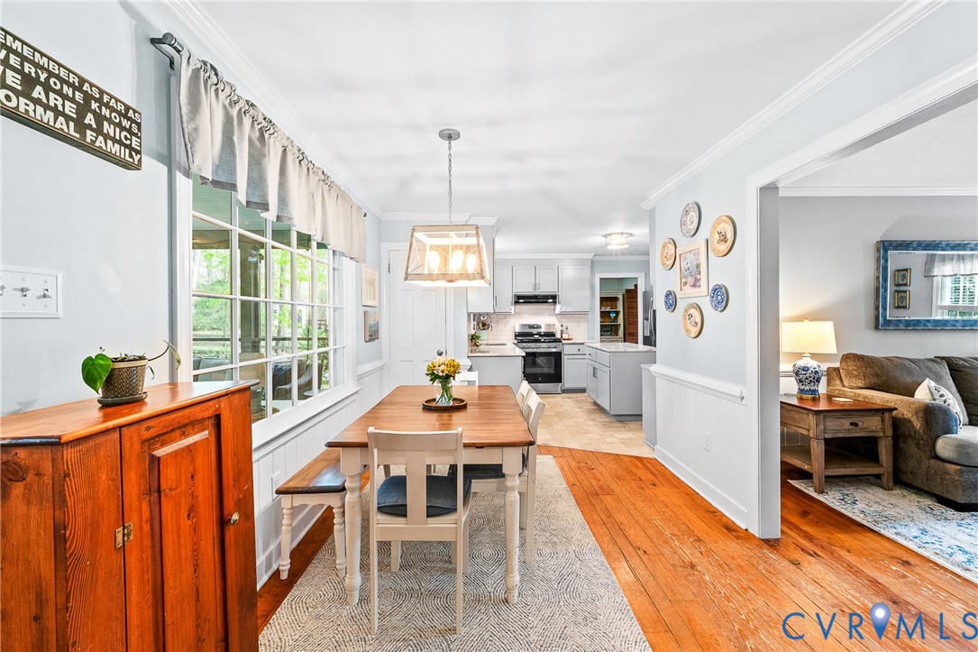 1013 Castle Hollow Road Midlothian, VA 23114 - Photo 13 of 45 Dining area featuring wainscoting, ornamental mold