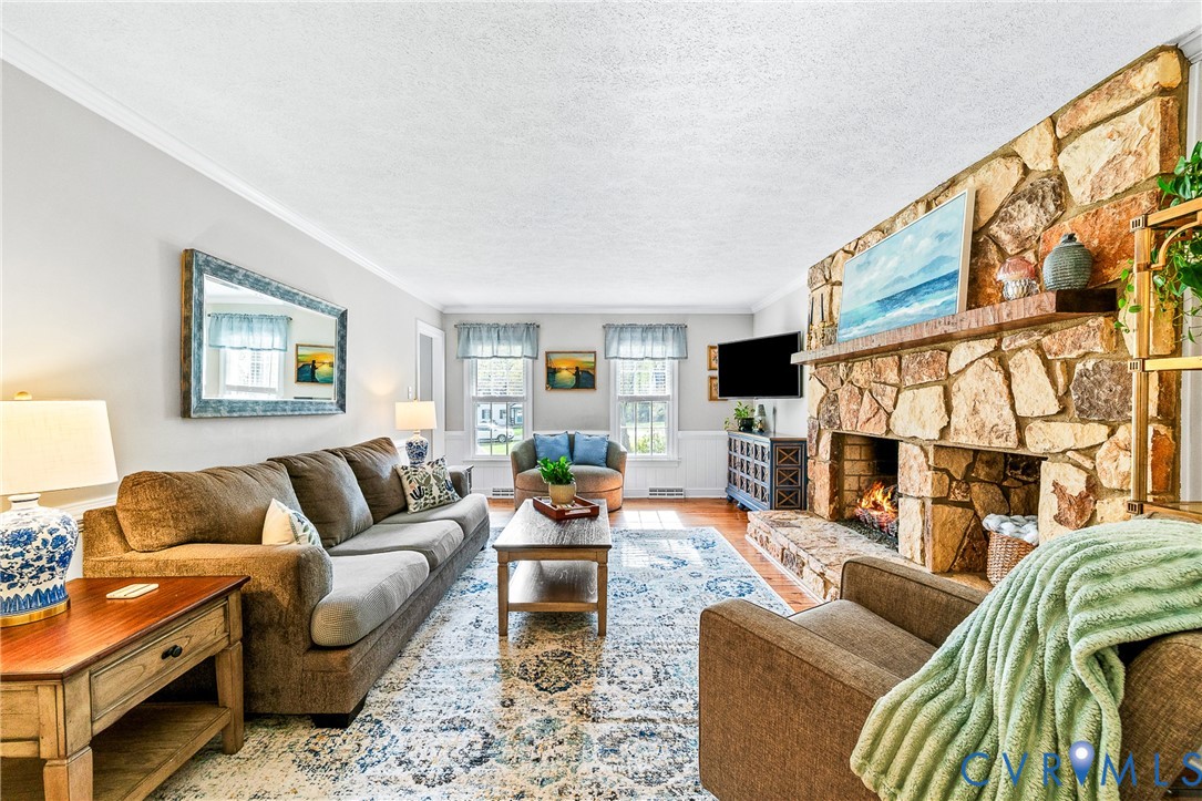 1013 Castle Hollow Road Midlothian, VA 23114 - Photo 14 of 45 a living room with furniture fireplace and a flat screen tv