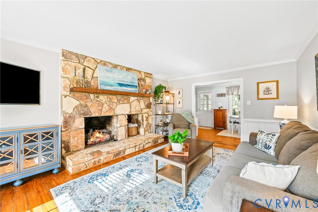 1013 Castle Hollow Road Midlothian, VA 23114 - Photo 15 of 45 a living room with furniture a flat screen tv and a fireplace