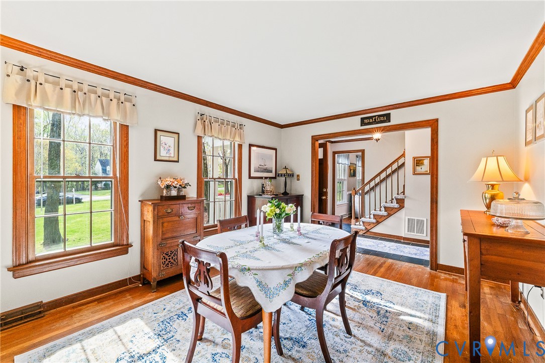 1013 Castle Hollow Road Midlothian, VA 23114 - Photo 18 of 45 Dining room with wood finished floors and crown mo