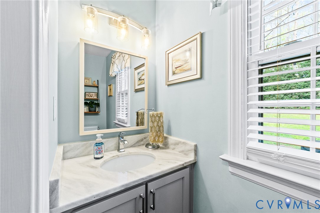1013 Castle Hollow Road Midlothian, VA 23114 - Photo 21 of 45 a bathroom with a granite countertop sink and a mirror