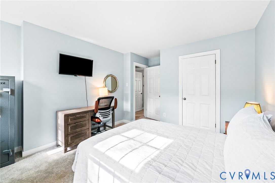 1013 Castle Hollow Road Midlothian, VA 23114 - Photo 30 of 45 Bedroom with light carpet and baseboards