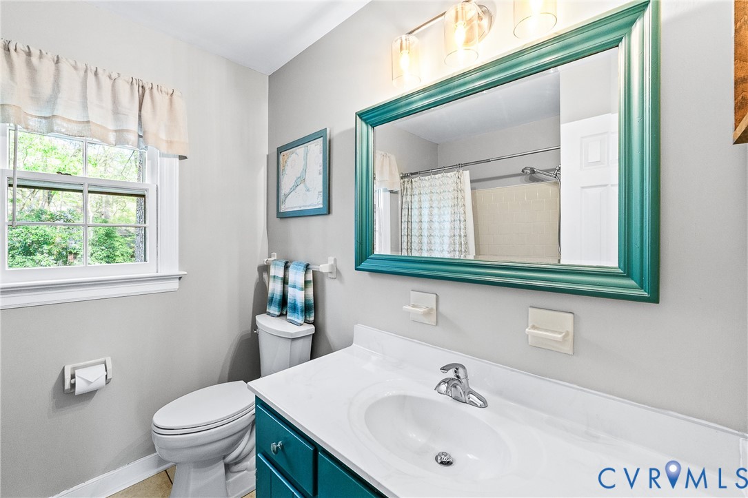 1013 Castle Hollow Road Midlothian, VA 23114 - Photo 32 of 45 Bathroom featuring vanity and curtained shower