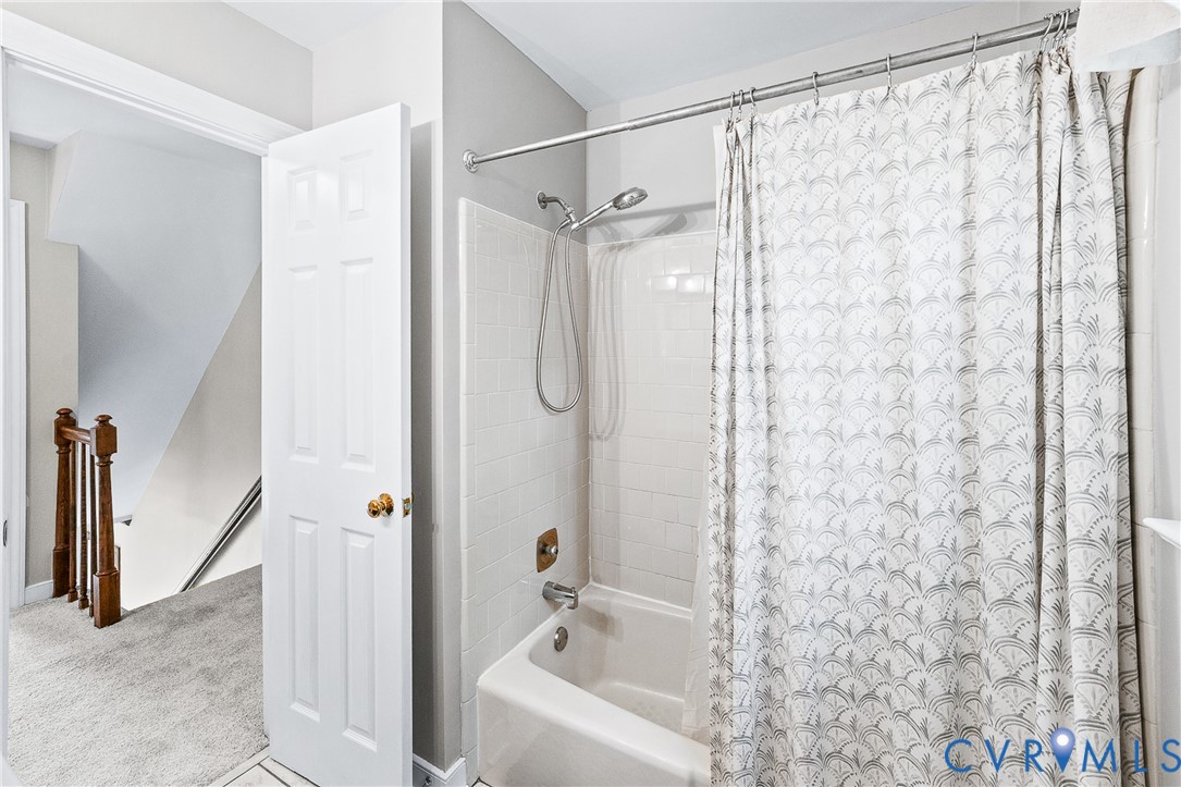 1013 Castle Hollow Road Midlothian, VA 23114 - Photo 33 of 45 a bathroom with a shower curtain and a sink