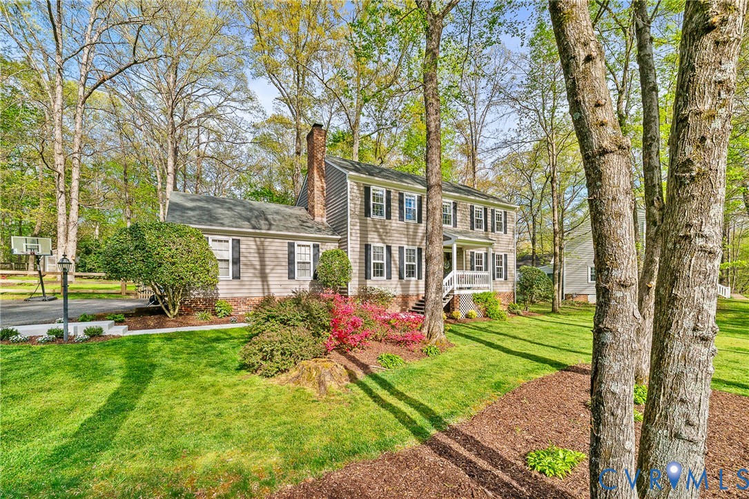 1013 Castle Hollow Road Midlothian, VA 23114 - Photo 38 of 45 Colonial house with a front yard and a chimney