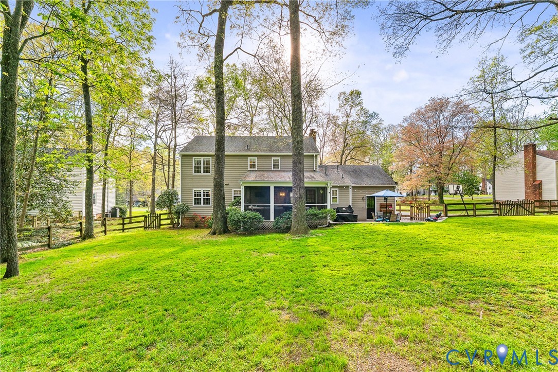 1013 Castle Hollow Road Midlothian, VA 23114 - Photo 39 of 45 Rear view of house featuring a fenced backyard, a