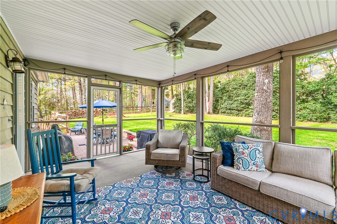 1013 Castle Hollow Road Midlothian, VA 23114 - Photo 42 of 45 Screened porch with ceiling fan and outdoor seatin