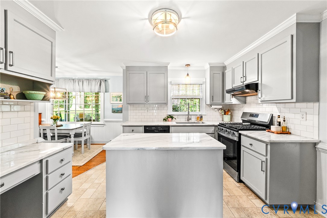 1013 Castle Hollow Road Midlothian, VA 23114 - Photo 9 of 45 a kitchen with stainless steel appliances granite countertop a stove a sink dishwasher and white cabinets with wooden floor