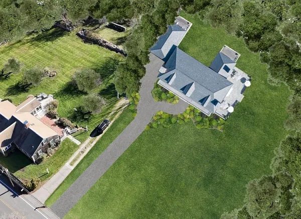 an aerial view of house with yard
