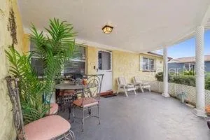 a living room with furniture a patio and a garden