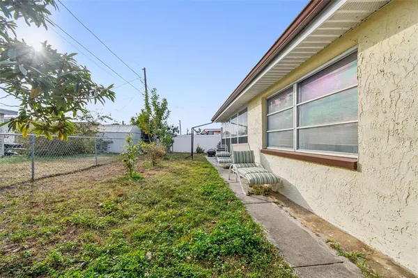 a house view with a backyard space