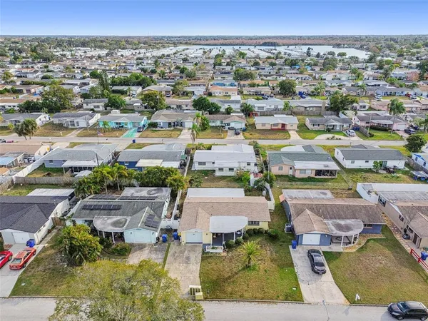 an aerial view of a swimming pool and mountain