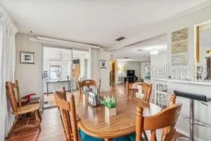 a dining room with furniture a rug and a chandelier