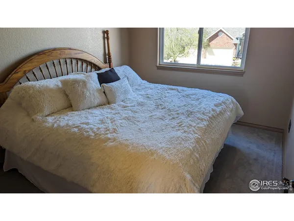 a black and white photo of a bedroom