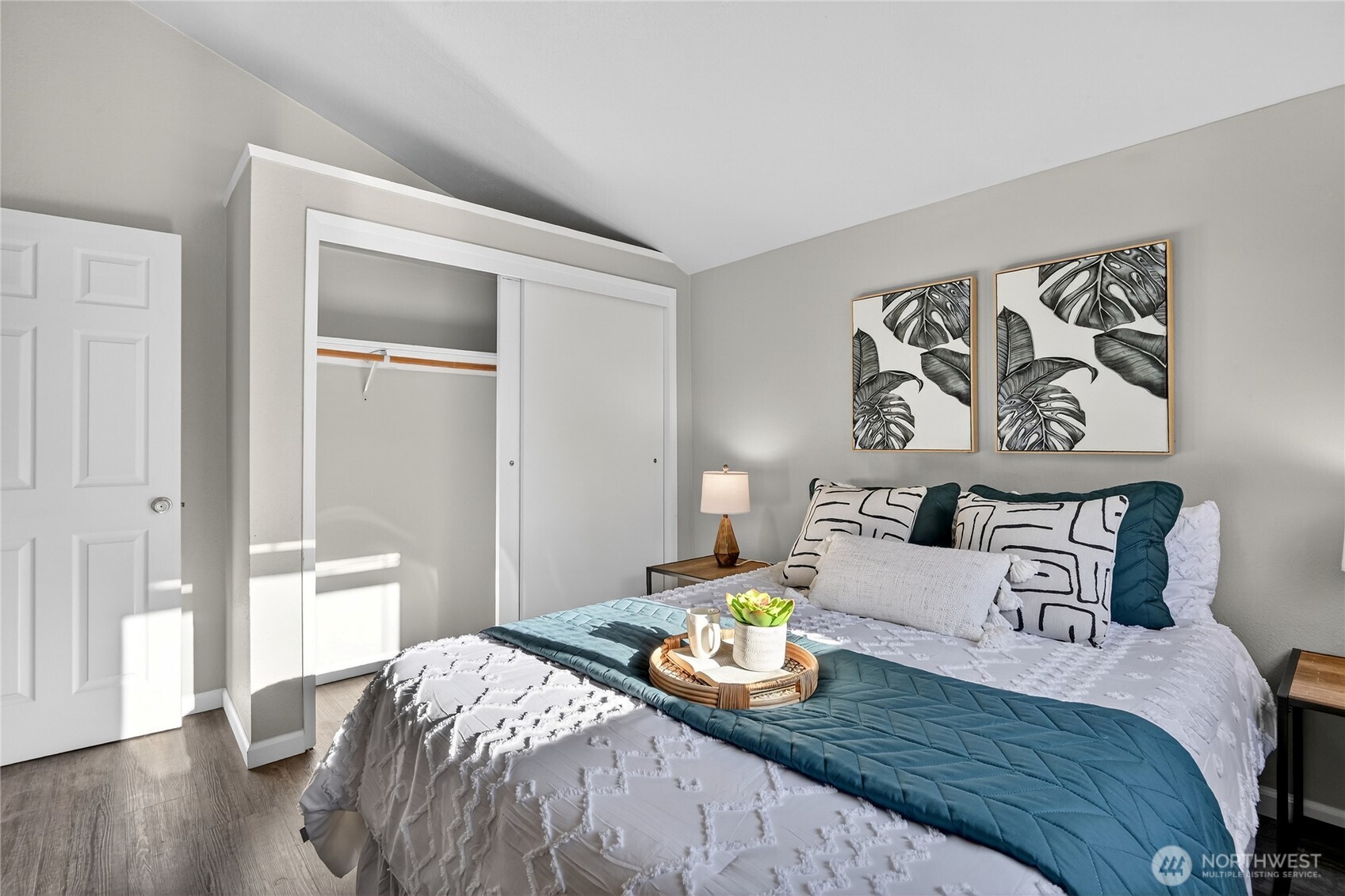 2422 McGregor Road Southeast Port Orchard, WA 98366 - Photo 22 of 32 a bedroom with a bed and wooden floor