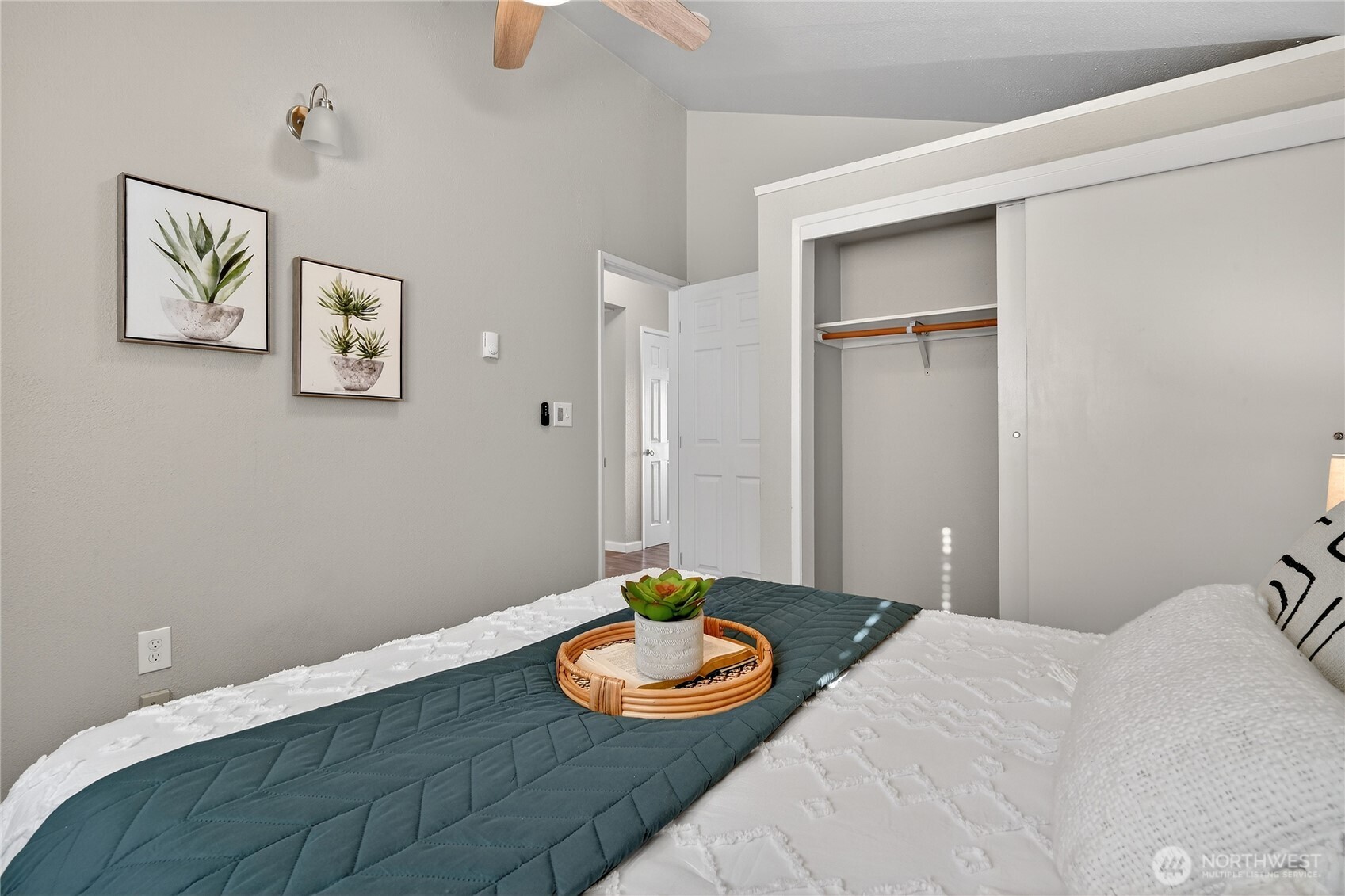 2422 McGregor Road Southeast Port Orchard, WA 98366 - Photo 23 of 32 a bedroom with a bed and a table with potted plant