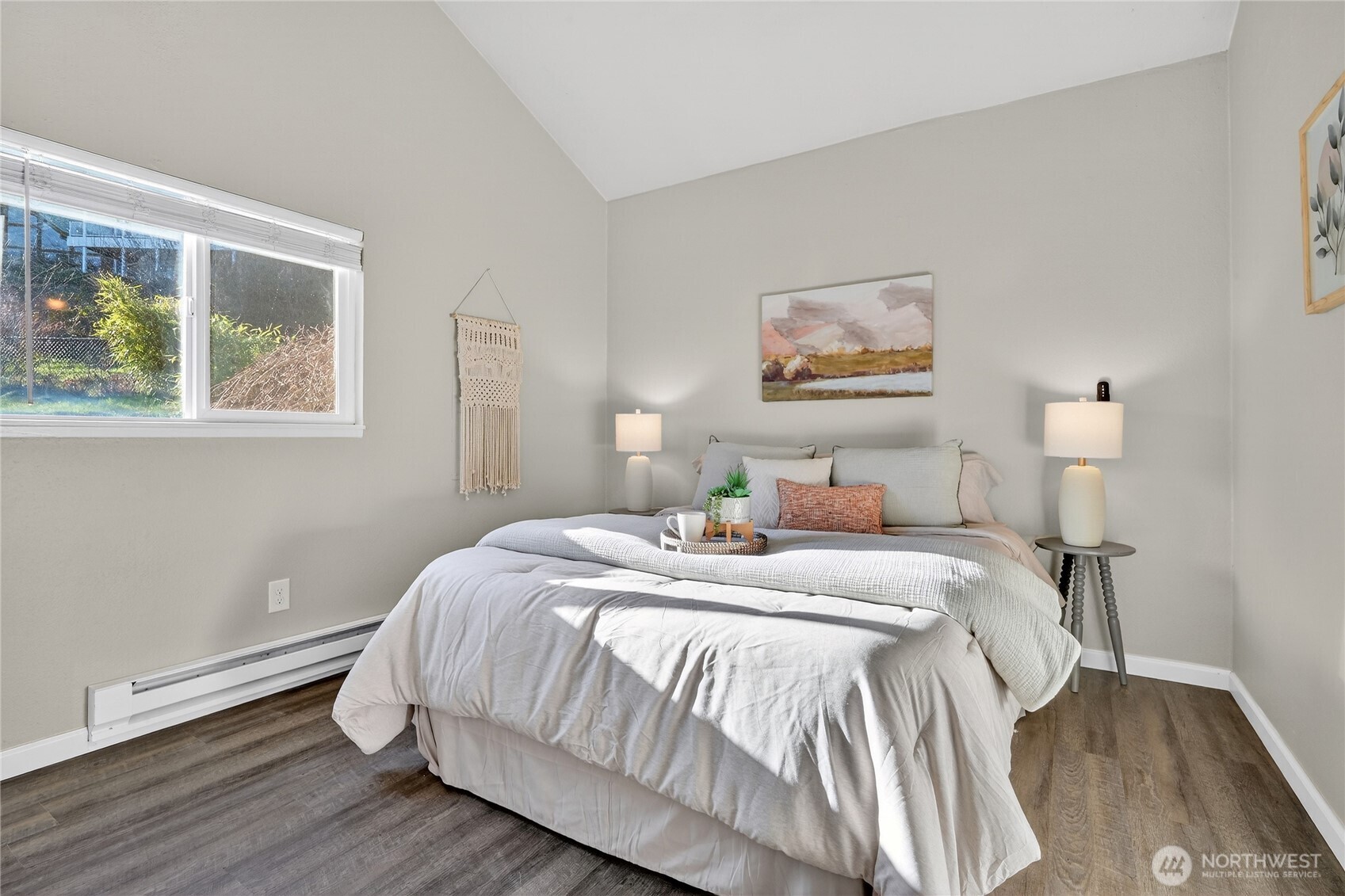 2422 McGregor Road Southeast Port Orchard, WA 98366 - Photo 25 of 32 a bed room with a bed and a painting on the wall