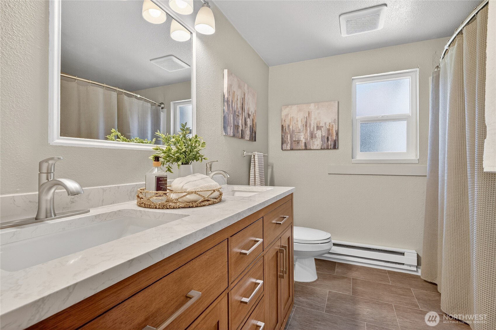 2422 McGregor Road Southeast Port Orchard, WA 98366 - Photo 28 of 32 a bathroom with a granite countertop sink a toilet and a mirror