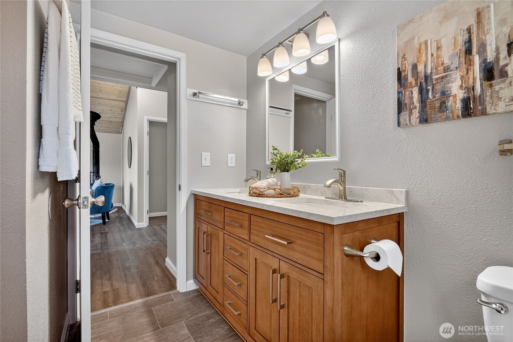 2422 McGregor Road Southeast Port Orchard, WA 98366 - Photo 29 of 32 a bathroom with a granite countertop sink a toilet and a mirror