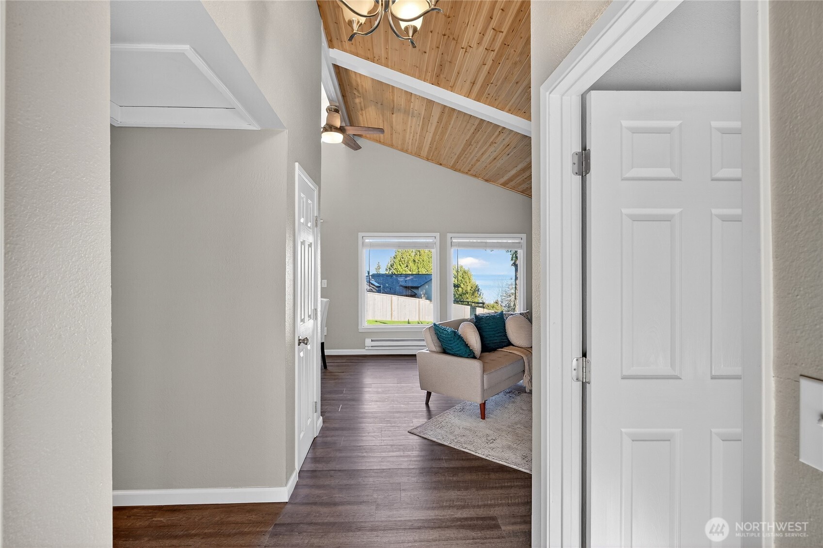 2422 McGregor Road Southeast Port Orchard, WA 98366 - Photo 4 of 32 a view of a hallway with a livingroom and wooden floor windows