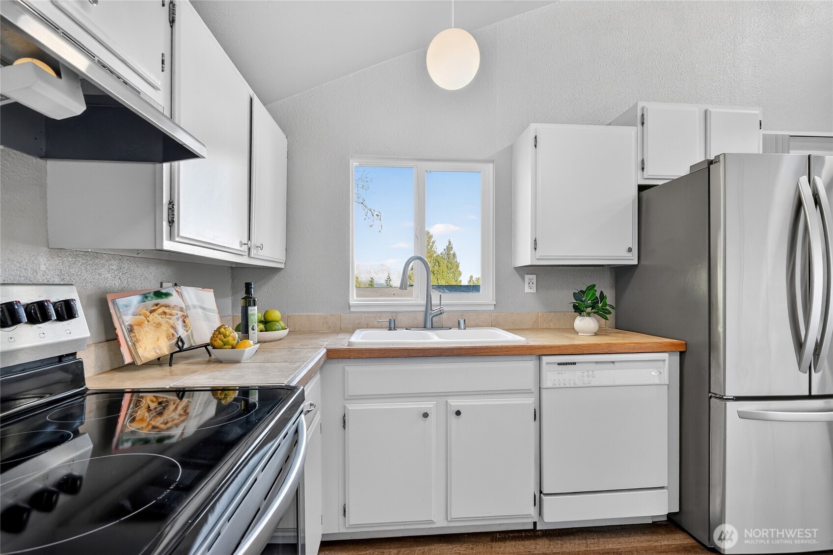 2422 McGregor Road Southeast Port Orchard, WA 98366 - Photo 9 of 32 a kitchen with a sink appliances and cabinets
