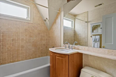 a bedroom with bed and window