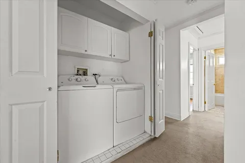 a spacious bedroom with a bed and a window
