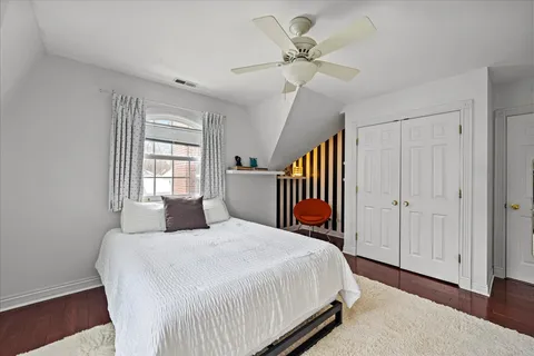 a bedroom with a bed and window