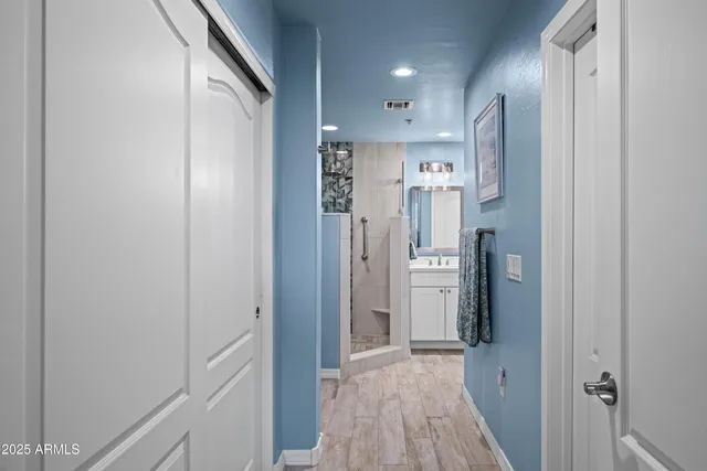 a view of hallway with wooden floor