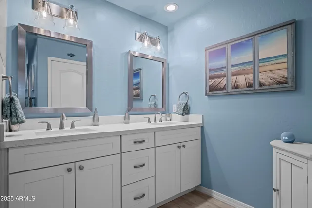 a bathroom with a sink a faucet a mirror and shower